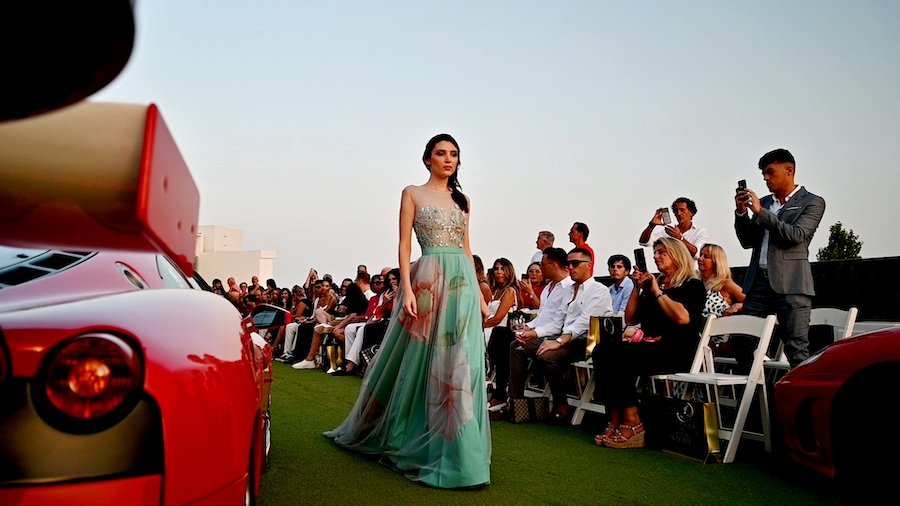 8_Susana_Hidalgo - Gossip Stone TV - Exclusive Celebrity Shows, Fashion, and Luxury News Susana Hidalgo Gown amongst a sea of Ferraris